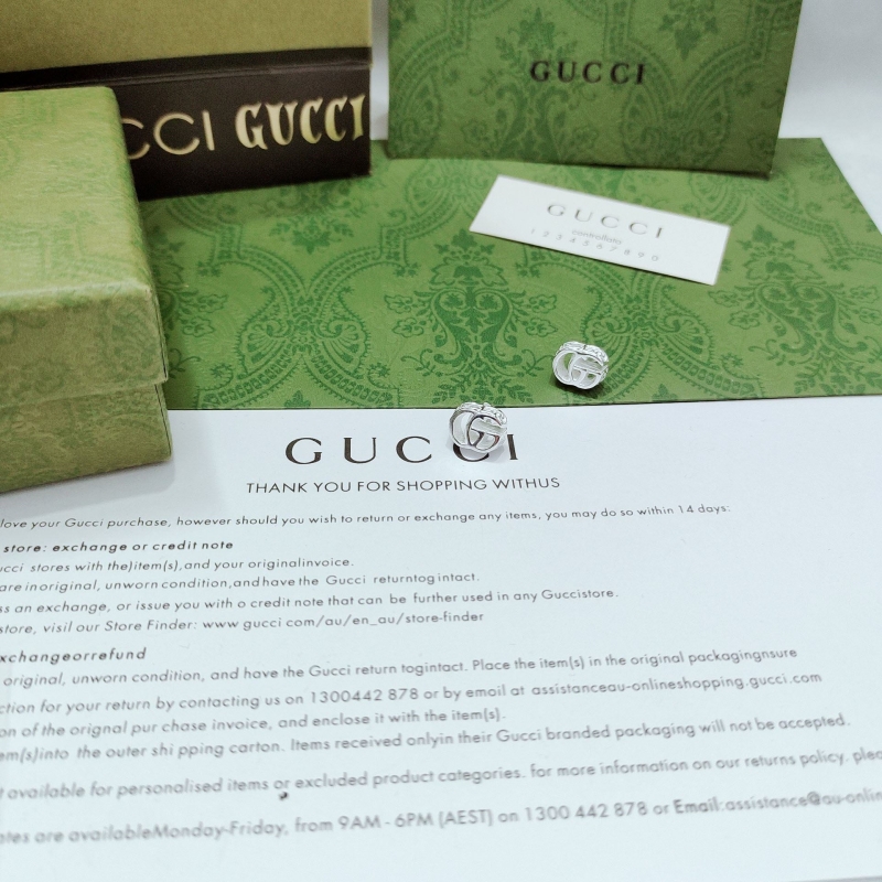 G*u*i earrings
